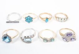 A collection of eight gemstone set dress rings.