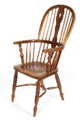 An elm Windsor chair, 19th century, the hoop-shaped back with pierced vase-shaped splat,