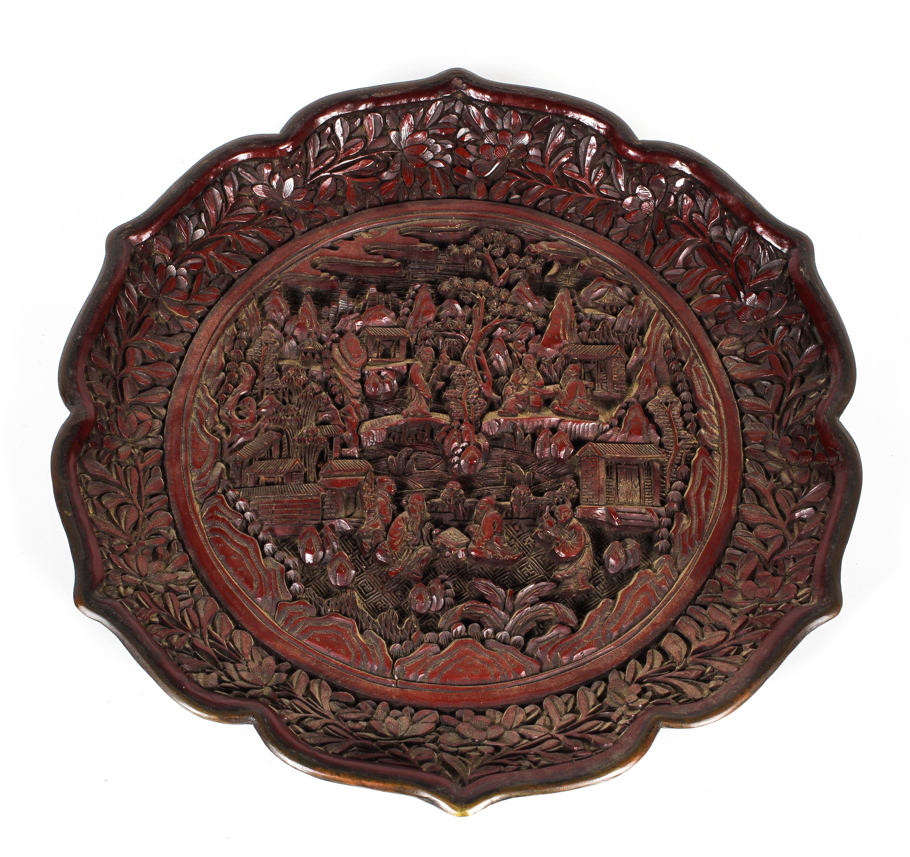 A Chinese carved cinnabar lacquer dish, 19th Century with 18th Century mark,