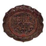 A Chinese carved cinnabar lacquer dish, 19th Century with 18th Century mark,