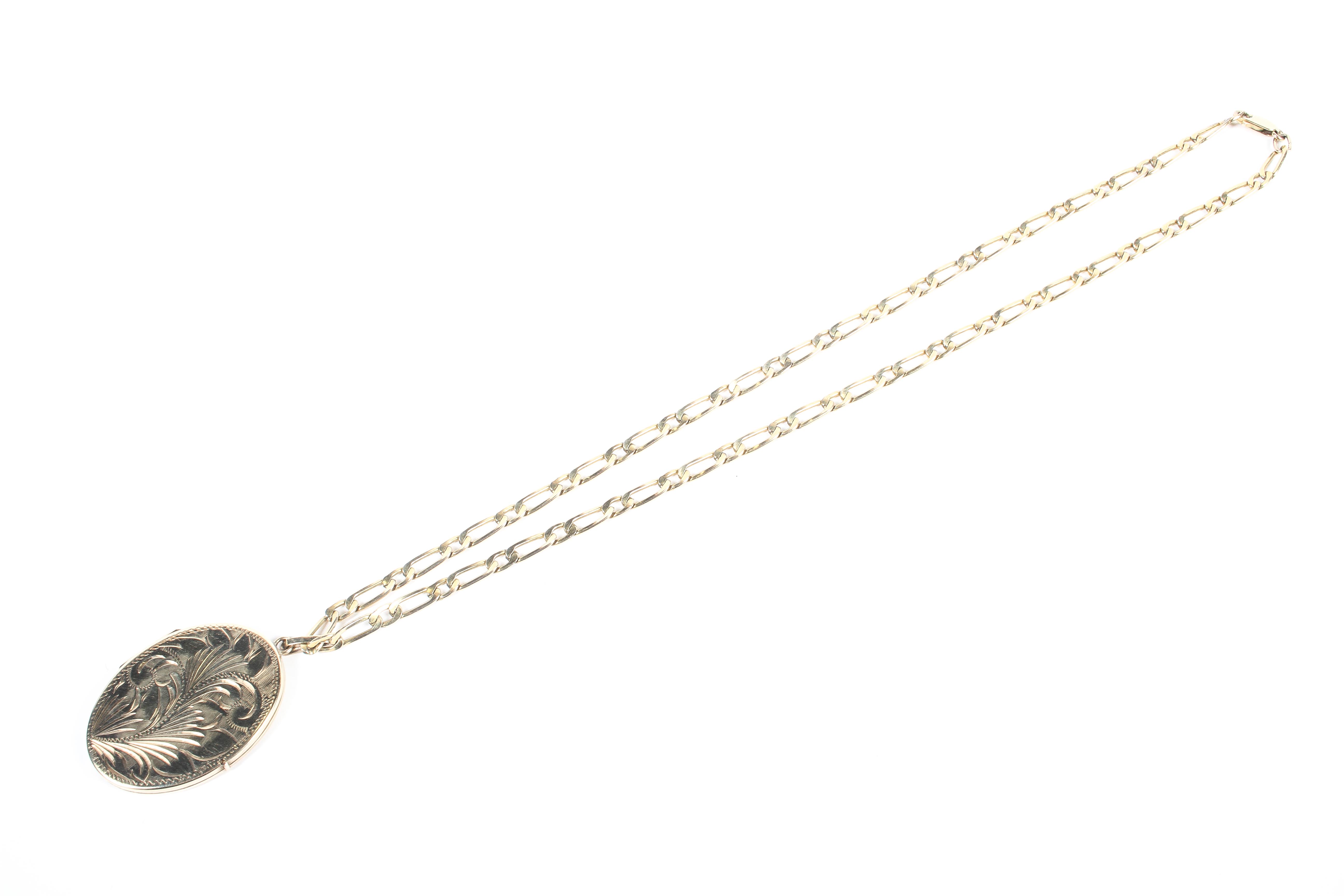 A yellow metal 40.0mm x 30.0mm oval locket pendant suspended from a 20 inch 1+1 Figaro chain. - Image 5 of 6