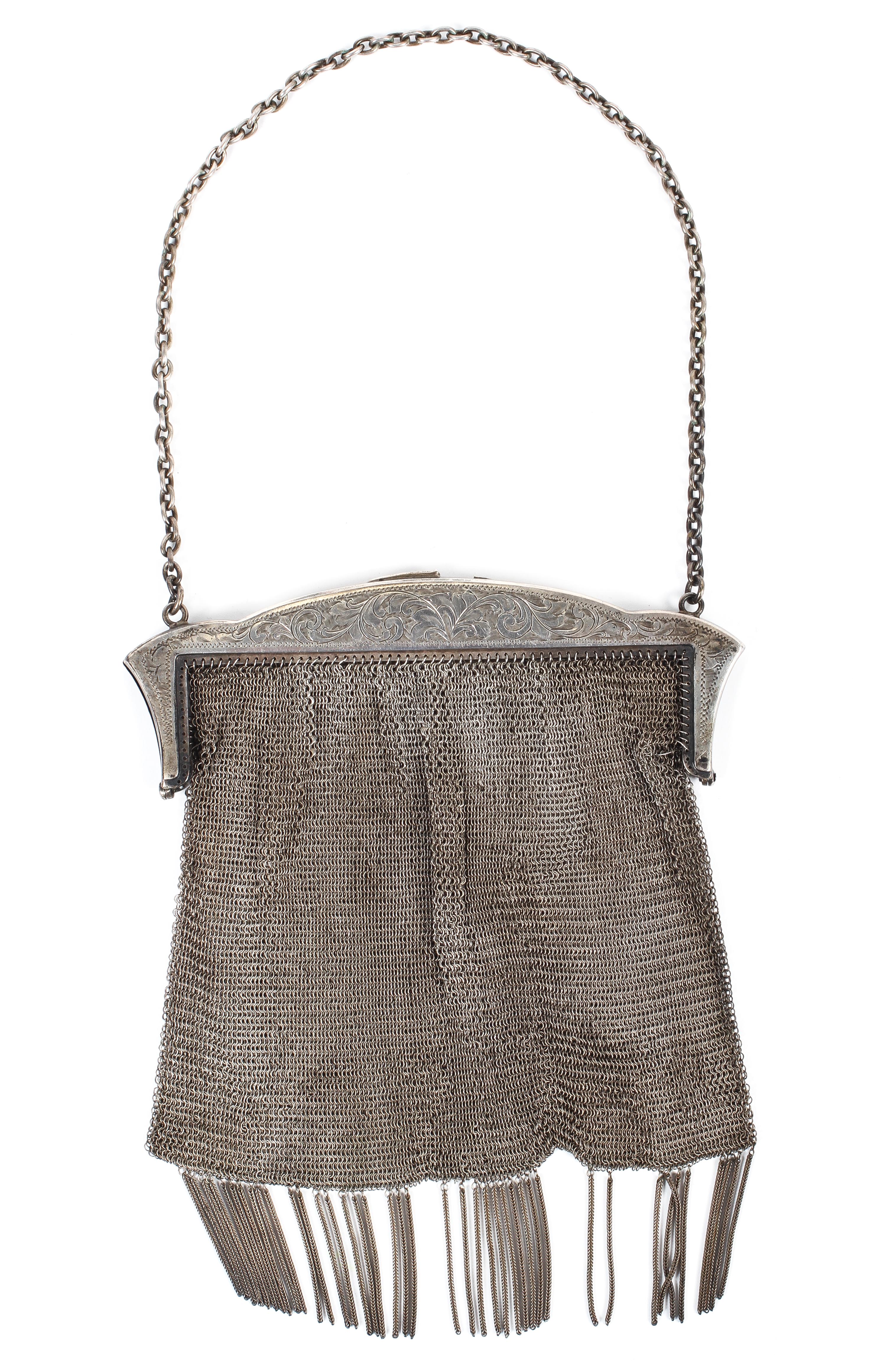A silver and mesh ladies purse, hallmarked Birmingham, 1916, maker's marks for F.D.