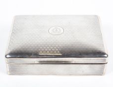 An early 20th century silver cigarette box, decorated throughout with engine turned motifs,