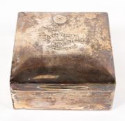 A silver square section cigarette box,