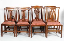 A matched set of eight late 18th/early19th century oak or mahogany dining chairs,