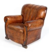 An Art deco tan leather upholstered armchair,