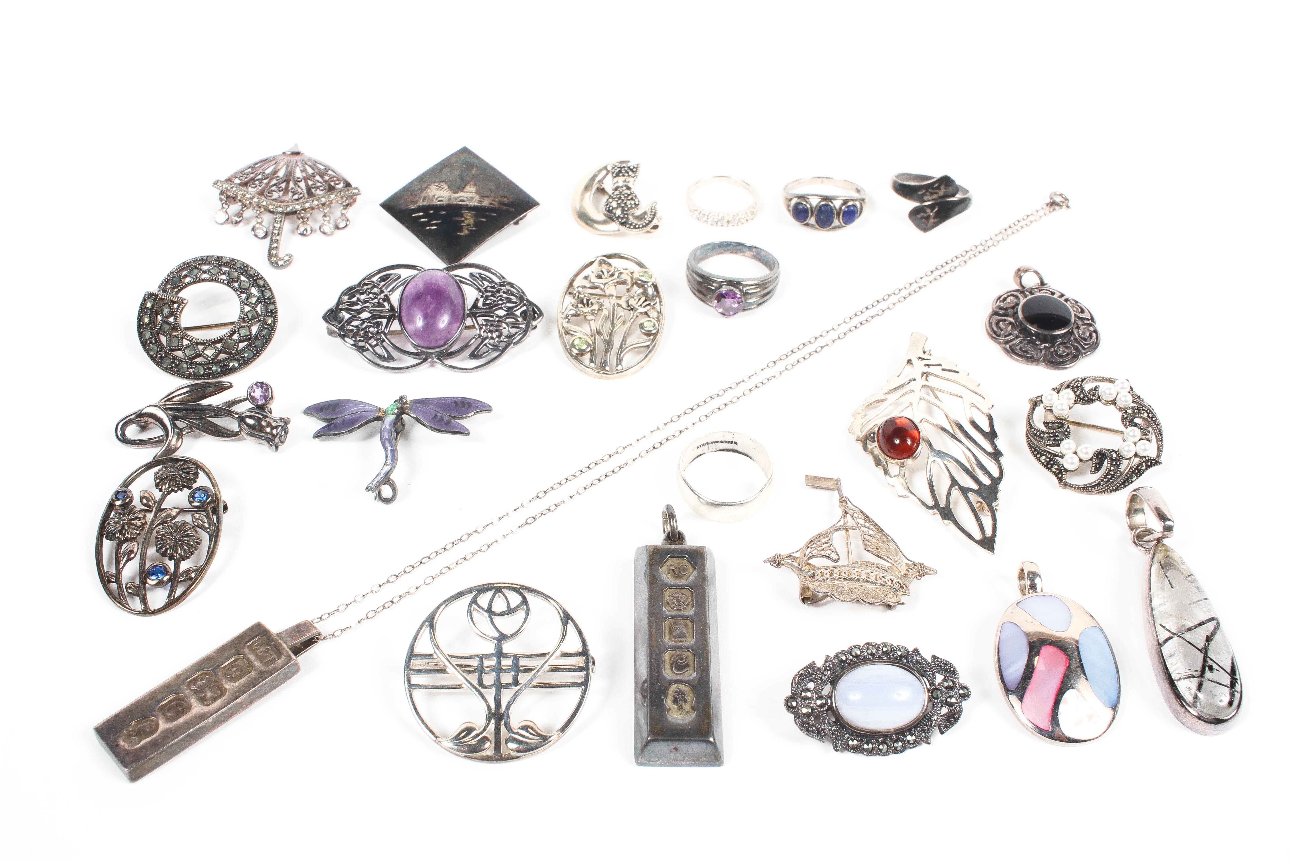 A collection of silver jewellery to include five pendants; fourteen brooches and five rings. - Image 2 of 2