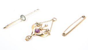 An amethyst and seed pearl pendant, an aquamarine bar brooch and a plain bar brooch