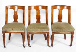 A set of three Victorian oak dining chairs,