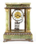 A French onyx, enamel and gilt-metal mounted striking mantel clock, of architectural form,