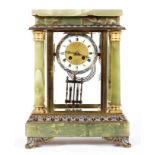 A French onyx, enamel and gilt-metal mounted striking mantel clock, of architectural form,