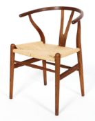 A Hans J Wegner Wishbone (Y) style teak chair, with paper cord seat, stamped FK06 to underside