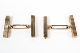 A pair of yellow metal abstract rectangular link cufflinks. Hallmarked 9ct gold, London.