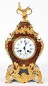 A French Boulle and gilt-metal mounted striking mantel clock, 19th century, of scroll outline,