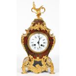 A French Boulle and gilt-metal mounted striking mantel clock, 19th century, of scroll outline,