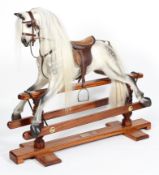 A Horsecraft Rocking Horse, early 20th century, painted dapple grey, with glass eyes, open mouth,