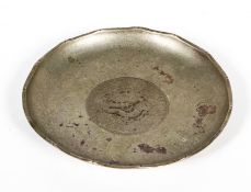 A Chinese white metal dish, the centre set with a a coin, marked HC and a single character