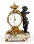 A French brass and bronze mounted mantel clock, the 2 1/2" enamelled dial with floral swags,