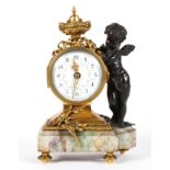 A French brass and bronze mounted mantel clock, the 2 1/2" enamelled dial with floral swags,