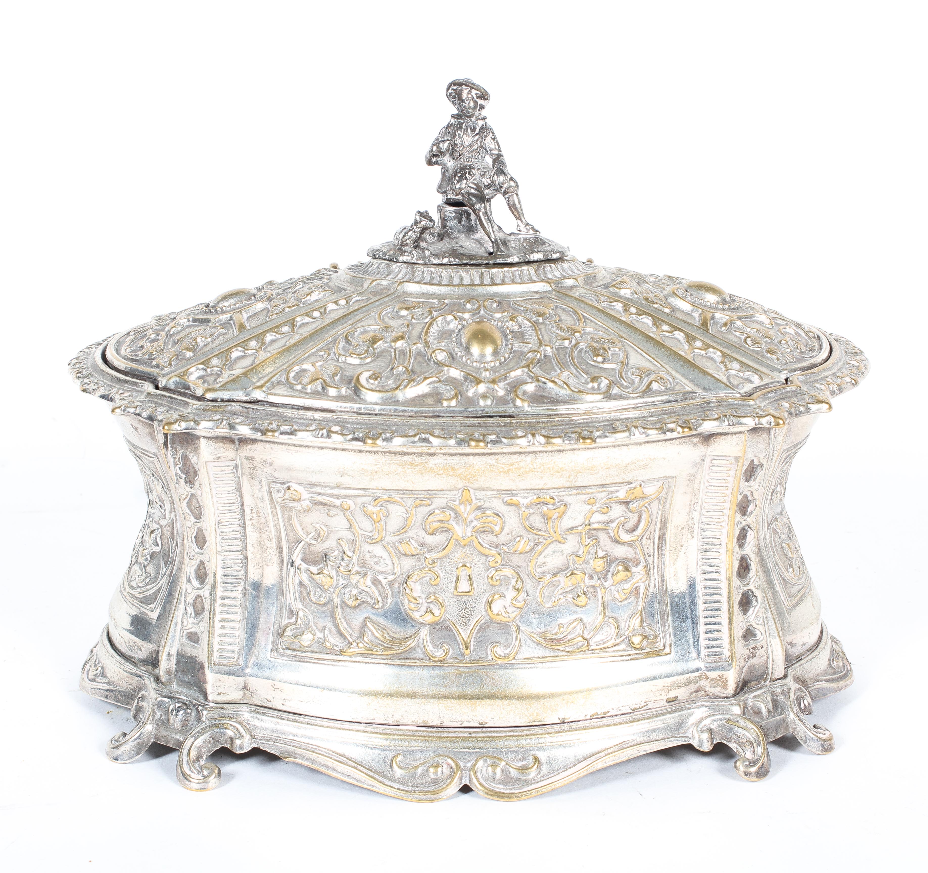 A late 19th century silver-plated casket and hinged cover, of shaped oval form,
