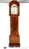 A mahogany and walnut long case clock, the 11" painted dial with floral spandrels,