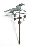 Folk Art: a copper weather vane in the form of a running horse above the points of the compass,