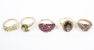 A collection of five gemstone set dress rings