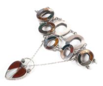 An open linked bracelet, each set with agate and finished with a heart shaped mourning padlock
