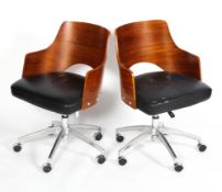 A pair of mid 20th century style plywood swivel chairs,
