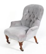 A Victorian button back arm chair, with serpentine shaped front, upholstered in pale blue velvet,