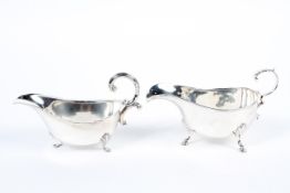 Two silver cream jugs, 19th century and later, each raised upon three stylized hoof feet,