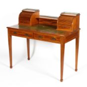 A late Victorian mahogany Carlton House style desk, inlaid with satinwood stringing throughout,