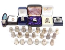 A collection of silver thimbles, boxed and unboxed, various dates and assay office marks,