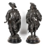 A pair of late 19th century French spelter figures, each wearing 17th century style dress,