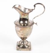 A George III silver cream jug, helmet shaped form, hallmarked London 1789 by Samuel Meriton II,