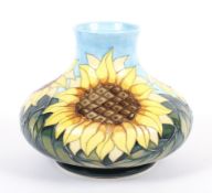 A Moorcroft Pottery vase of compressed ovoid form, decorated in the Sunflower pattern,