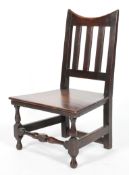 A Victorian oak child's chair, with curved top rail, pierced back and plain seat,