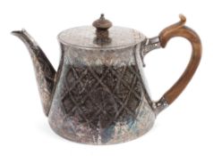 An ornate early Victorian silver teapot,