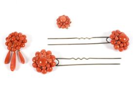 A set of 20th Century coral jewellery, comprising a locket and brooch mounted in yellow metal,