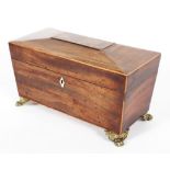 A George III mahogany gilt-metal mounted tea caddy, of sarcophagus form,