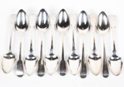 A large selection of George III and later silver table spoons, with varying hallmarks,