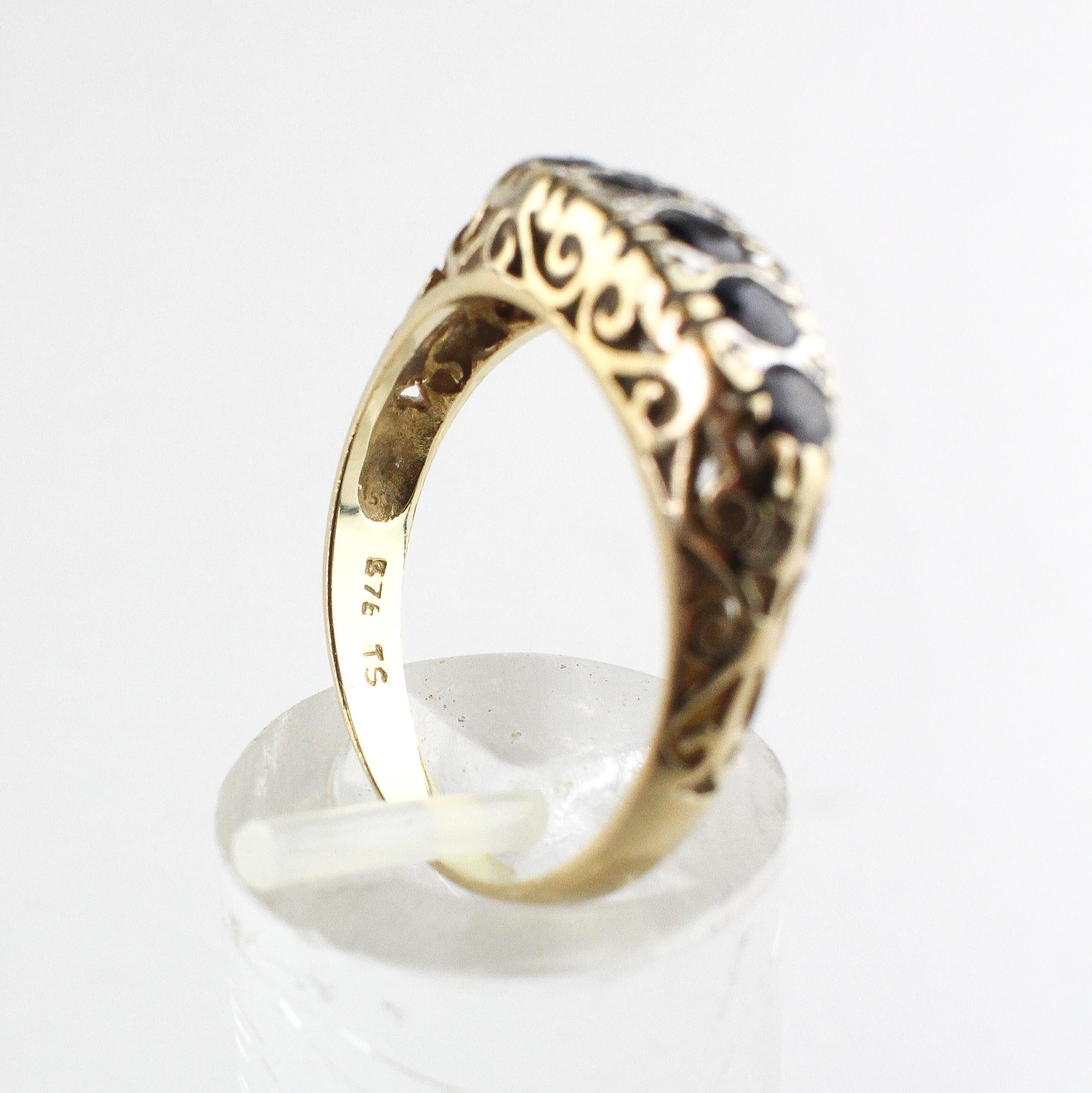 A yellow metal half hoop ring set with five round cut sapphires. - Image 4 of 4