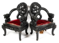 A pair of Chinese hardwood arm chairs, late 19th/early 20th century,