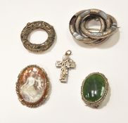 A selection of silver and white metal jewellery including a cameo brooch, other brooches,