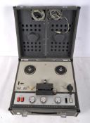 A 1960s Sony TC200 2 channel reel to reel portable tape recorder, in grey leatherette case,