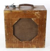 A vintage wood cased portable amplifier, with octagonal panelled speakers, 43.