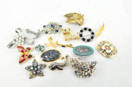 Selection of costume jewellery brooches, of assorted designs,