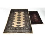 Two Persian floor rugs, both with medallion detailing,