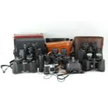 A collection of assorted binoculars, including a pair of Snow-Man 7x50 no.