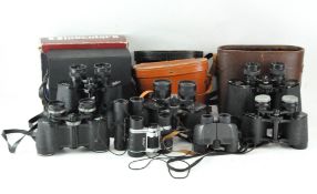 A collection of assorted binoculars, including a pair of Snow-Man 7x50 no.